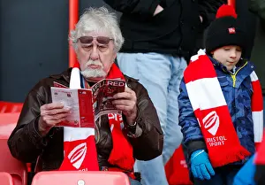 Bristol City V West Ham United - Fans Prints: Bristol City Fan Absorbed in Match Program before FA Cup Clash vs. West Ham United