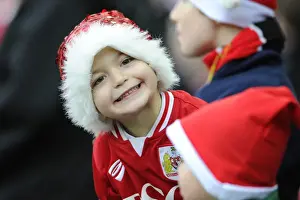 Bristol City V QPR Prints: Bristol City Fan in Christmas Hat Celebrates at Ashton Gate during Sky Bet Championship Match against QPR