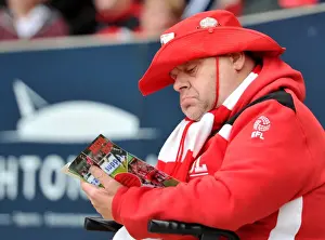 Bristol City V Blackburn Rovers Prints: Bristol City Fan Delves into Match Program before Kick-off vs Blackburn Rovers