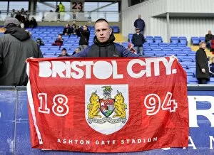 Images Dated 8th March 2014: Bristol City Fan Waves Flag at Shrewsbury Town Match, Sky Bet League One, 2014
