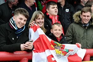 Images Dated 16th April 2016: Bristol City Fans in Action at Brentford's Griffin Park during Sky Bet Championship Match