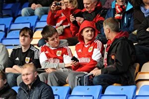 Images Dated 8th March 2014: Bristol City Fans in Action at Shrewsbury Town's New Meadow during Sky Bet League One Match