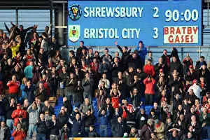 Framed Print : Bristol City Fans in Action at Shrewsbury Town's New Meadow, March 2014 Framed Print : Bristol City Fans in Action at Shrewsbury Town's New Meadow, March 2014