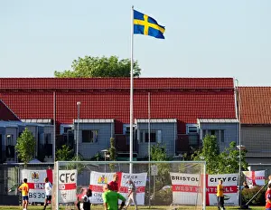 Bristol City fans decorate the ground with flags below the Swedish flag