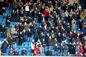 Images Dated 1st January 2013: Bristol City Fans at The Den: A Sea of Passion During Millwall vs. Bristol City Championship Match