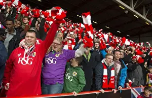Bristol City Fans United: A Sea of Red and White Scarves at Ashton Gate