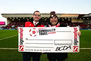 Bristol City FC: 50/50 Draw Winner Celebrates at Ashton Gate During Bristol City vs