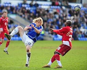 Images Dated 27th March 2010: Bristol City FC: Peterborough's Mackail-Smith Clears the Ball in Championship Clash (March 2010)