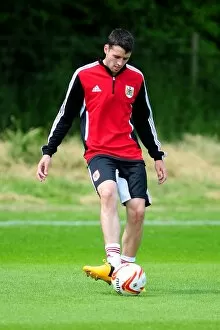 Images Dated 27th June 2013: Bristol City FC: Pre-Season Training in Full Gear (June 2013) - Brendan Maloney at Work