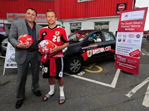 Images Dated 3rd August 2012: Bristol City FC Surprise Fans with Car Full of Footballs from Wessex Garages
