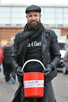 Bristol City FC's Louis Carey Collects for Charity During FA Cup Match