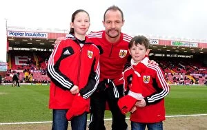 Images Dated 23rd February 2013: Bristol City: First Game Memories - Louis Carey Surprises Young Fans with Caps vs Barnsley