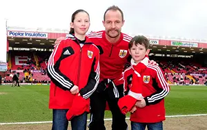 Bristol City V Barnsley Prints: Bristol City: First Game Memories - Louis Carey Surprises Young Fans with Caps vs Barnsley (February 2013)