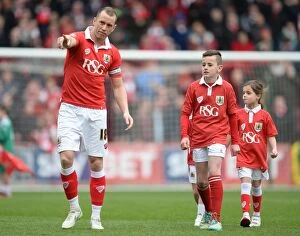Images Dated 14th March 2015: Bristol City Football Club: Aaron Wilbraham Guides Mascots at Ashton Gate - Sky Bet League One