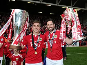 Bristol City Football Club: Joe Bryan and Greg Cunningham Lift Sky Bet League One and JPT Trophies