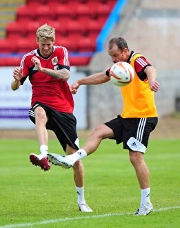Images Dated 31st July 2012: Bristol City Football Club: Jon Stead vs. Louis Carey - Intense Training Battle