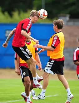 Framed Print : Bristol City Football Club: Jon Stead vs Joe Bryan - Aerial Battle in Pre-Season Training, 2012
