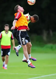 Bristol City Football Club: Paul Anderson and Bobby Reid Compete for High Ball during Training