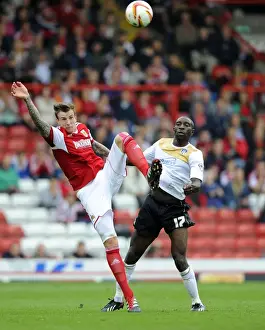 Bristol City V Colchester United Prints: Bristol City Football Rivalry: Aden Flint vs Jabo Ibehre - Clash at Ashton Gate