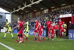 Bristol City Football Team and Mascots Emerge from Ashton Gate Tunnel for Sky Bet Championship Match Against Reading