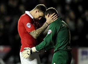 Images Dated 13th January 2015: Bristol City Footballers Aden Flint and Frank Fielding Embrace Before FA Cup Kickoff at Ashton