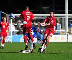 Images Dated 27th March 2010: Bristol City Footballers Marvin Elliott and Cole Skuse Clash for the Ball against Peterborough
