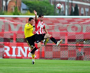 Images Dated 26th July 2010: Bristol City Goalkeeper, Stephen Henderson clears the ball under pressure