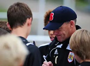 Bristol City Manager, Steve Coppell signs autographs for the academy players