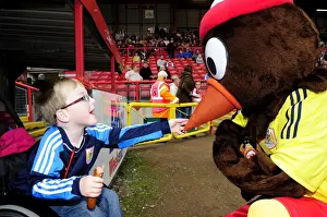 Bristol City V Colchester United Prints: Bristol City Mascot Welcomes Young Fan at Ashton Gate during Bristol City vs Colchester United