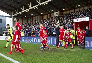 Bristol City Players and Mascots Make Their Entrance at Ashton Gate for Sky Bet Championship Match against Reading