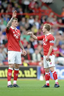 Bristol City V Doncaster Rovers Prints: Bristol City Rivalry: Aden Flint and Wade Elliott's Heated On-Field Exchange