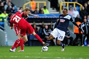 Images Dated 1st January 2013: Bristol City Shuts Down Millwall's Nadjim Abdou with Paul Anderson and Jon Stead