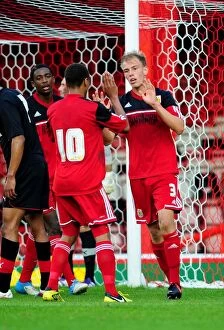 Images Dated 4th September 2012: Bristol City U21s Celebrate Win: Bobby Reid Congratulates Tom King