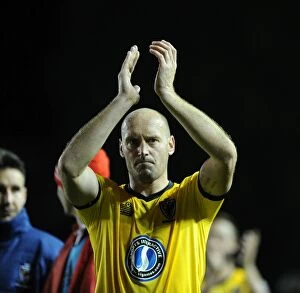 Images Dated 11th November 2014: Bristol City vs AFC Wimbledon: Adam Barrett Cheers on Traveling Fans