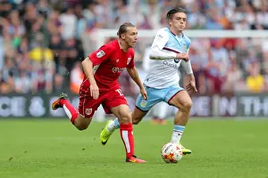 Bristol City V Aston Villa Prints: Bristol City vs Aston Villa: Luke Freeman vs Jack Grealish - Intense Battle at Ashton Gate