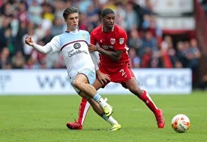 Images Dated 27th August 2016: Bristol City vs Aston Villa: Mark Little Challenges Jack Grealish
