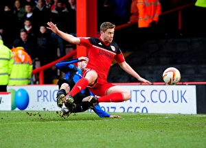 Bristol City vs Barnsley: Intense Moment as Martin Cranie Tackles Steven Davies in Npower Championship Match