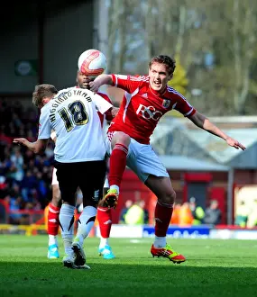Bristol City vs Barnsley: Neil Kilkenny and Kallum Higginbotham Clash on the Pitch