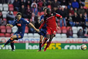 Bristol City V Blackpool Prints: Bristol City vs Blackpool: Albert Adomah vs Craig Cathcart Battle for Ball in Championship Match