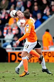 Blackpool V Bristol City Collection: Bristol City vs Blackpool: Intense Aerial Battle Between Liam Kelly and Angel