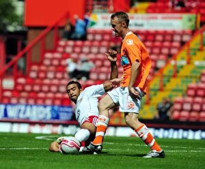 Images Dated 31st July 2010: Bristol City vs Blackpool: Liam Fontaine's Intense Battle for Ball Possession - Championship