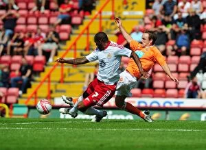 Images Dated 31st July 2010: Bristol City vs Blackpool: Marvin Elliott's Battle for the Ball - Championship Football Match, 2010