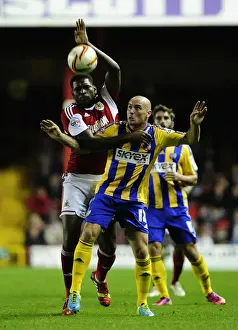 Bristol City V Brentford Prints: Bristol City vs Brentford: Emmanuel-Thomas vs McCormack - Intense Battle for Possession