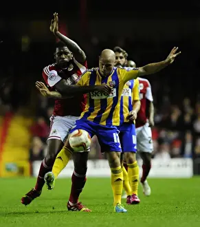 Bristol City V Brentford Prints: Bristol City vs Brentford: Intense Battle for Possession - Jay Emmanuel-Thomas vs Alan McCormack