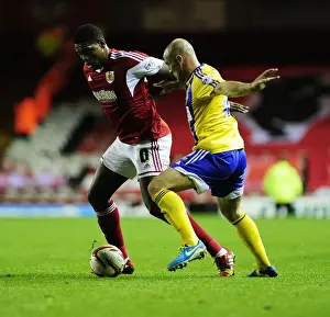 Bristol City V Brentford Prints: Bristol City vs Brentford: Jay Emmanuel-Thomas vs Alan McCormack - Intense Football Action