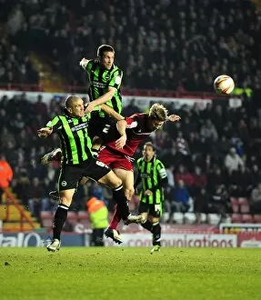 Images Dated 5th March 2013: Bristol City vs Brighton & Hove Albion: Matthew Upson Soars Above Jon Stead