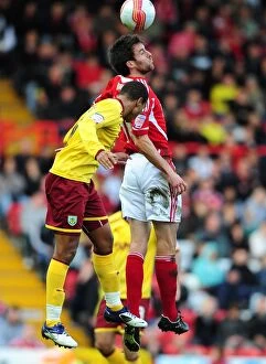 Images Dated 5th November 2011: Bristol City vs Burnley: Cole Skuse vs Junior Stanislas Battle for High Ball - Championship Match