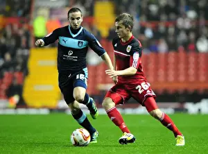 Framed Print : Bristol City vs Burnley: Joe Bryan Faces Martin Paterson Challenge in Championship Clash