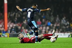Framed Print : Bristol City vs Burnley: Mark Wilson Tackles Junior Stanislas in Championship Clash