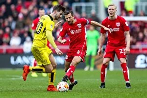 Images Dated 4th March 2017: Bristol City vs Burton Albion: Gary O'Neil Tackled by Luke Murphy